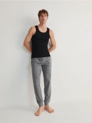 Spodnie piżamowe 2 pack - czarny. Czarne spodnie materiałowe męskie Reserved, bez wzorów, z bawełny. W wyprzedaży za 89.99 zł.