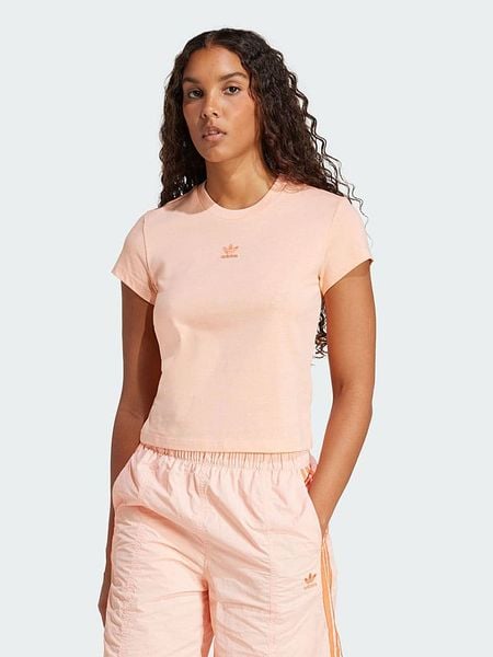 Adidas Koszulka w kolorze pomarańczowym rozmiar: S. Pomarańczowe bluzki damskie Adidas, s, bez wzorów, bez kołnierzyka. Za 55.95 zł.