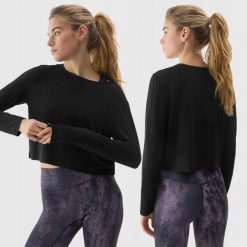 LONGSLEEVE DAMSKI 4F CROP-TOP DO JOG BLUZA Z DODATKIEM MODALU KOLOR CZARNY. Czarne bluzy bez kaptura damskie 4f, l, bez wzorów, z materiału, bez ramiączek, bez kaptura. Za 79.99 zł.