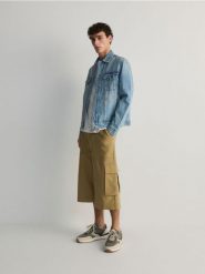 Szorty wide leg - złamana biel. Szorty męskie Reserved, bez wzorów, z bawełny. W wyprzedaży za 79.99 zł.