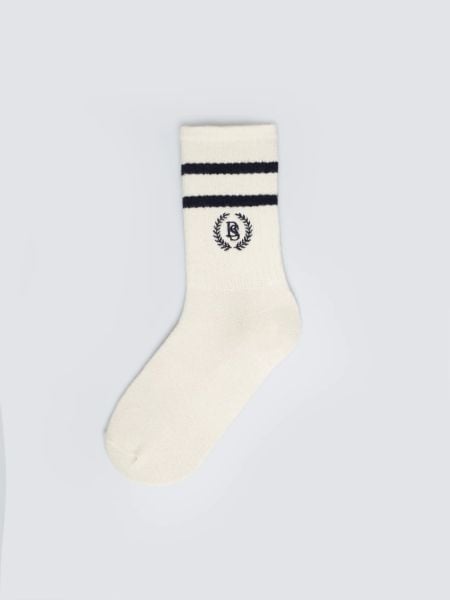 Skarpety damskie długie białe z granatowymi paskami Prepaliana 403. Niebieskie skarpetki damskie Big Star, bez wzorów, z bawełny. Za 19.99 zł.