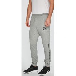 Puma - Spodnie. Szare spodnie sportowe męskie Puma, z bawełny. W wyprzedaży za 159.90 zł.