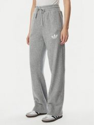 Adidas Spodnie dresowe Essentials IA4439 Szary jasny Loose Fit. Szare spodnie dresowe damskie Adidas, l, bez wzorów, z dresówki. Za 299.99 zł.