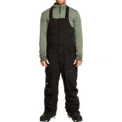 Spodnie narciarskie męskie Quiksilver Utility Snow Bib. Czarne spodnie materiałowe męskie Quiksilver, bez wzorów, z poliesteru, sportowe. Za 606.00 zł.