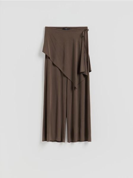 Spodnie z chustą - beżowy. Brązowe spodnie materiałowe damskie Reserved, bez wzorów, z dzianiny. Za 99.99 zł.