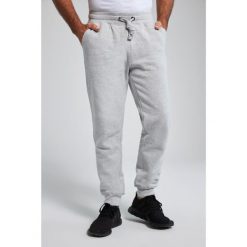 Męskie Spodnie dresowe ściągane sznurkiem nowoczesny krój do roz. 8XL. Szare spodnie dresowe męskie JAY-PI, bez wzorów, z bawełny. Za 244.99 zł.