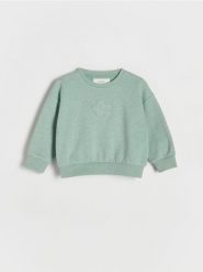 Bawełniana bluza z aplikacją - jasnozielony. Zielone bluzy i bluzki niemowlęce Reserved, z aplikacjami, z bawełny, bez ramiączek, bez kaptura. W wyprzedaży za 22.99 zł.