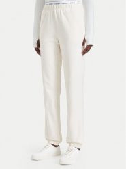 Guess Spodnie dresowe O5RB01 KCO31 Kremowy Regular Fit. Białe spodnie dresowe damskie Guess, xl, z aplikacjami, z bawełny. Za 264.99 zł.