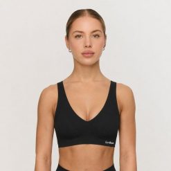 Biustonosz damski bezszwowy czarny Comfy. Czarne biustonosze sportowe damskie GYMBEAM, bez wzorów, z elastanu. Za 63.90 zł.
