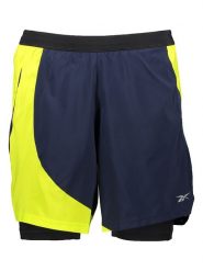 Reebok Szorty w kolorze granatowo-żółtym do biegania rozmiar: M. Niebieskie szorty męskie Reebok, bez kołnierzyka. Za 90.45 zł.