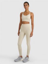 4F Legginsy treningowe bezszwowe damskie - beżowe M/L. Brązowe legginsy damskie 4f, l, bez wzorów, z dzianiny, z podwyższonym stanem, na fitness i siłownię. Za 129.99 zł.