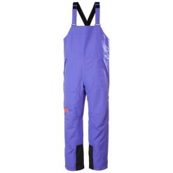 Damski kombinezon narciarski Helly Hansen Emiko Shell Bib. Fioletowe kombinezony damskie Helly Hansen, bez wzorów, sportowe, bez kołnierzyka, bez ramiączek. Za 1,069.50 zł.