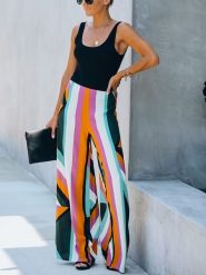 LA Angels Spodnie ze wzorem rozmiar: XL. Spodnie materiałowe damskie LA Angels, bez wzorów, z materiału. Za 154.95 zł.
