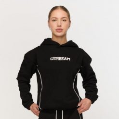Bluza damska fitness z kapturem czarna Varsity. Czarne bluzy sportowe damskie GYMBEAM, m, z bawełny. Za 139.90 zł.