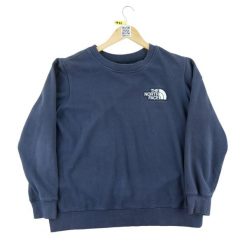 Sweter damski The North Face granatowy. Niebieskie swetry klasyczne damskie The North Face, l, z materiału, bez kołnierzyka. Za 106.46 zł.