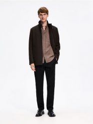 Spodnie slim fit z bawełną - czarny. Czarne spodnie materiałowe męskie Reserved, bez wzorów, z bawełny. Za 159.99 zł.