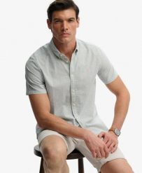 Superdry Klasyczna koszula Seersucker krótki rękaw – 100% bawełna organiczna. Białe koszule damskie Superdry., na lato, xl, bez wzorów, z bawełny, klasyczne, bez kołnierzyka, bez ramiączek. Za 282.85 zł.