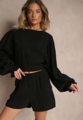 Czarna Bawełniana Bluzka Typu Nietoperz z Wiązaniem Sepionna. Czarne bluzki damskie Renee, bez wzorów, z bawełny, eleganckie, bez kołnierzyka, bez ramiączek. Za 99.99 zł.