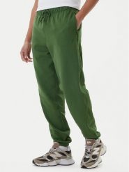 New Balance Spodnie dresowe MP41508 Zielony Relaxed Fit. Zielone spodnie dresowe męskie New Balance, bez wzorów, z bawełny. Za 289.99 zł.