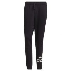 Spodnie adidas Essentials Colorblock Fleece. Białe spodnie sportowe męskie Adidas, z bawełny. Za 173.45 zł.