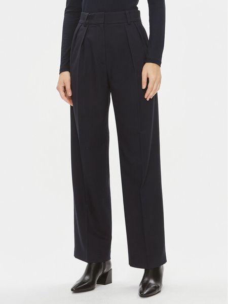 Tommy Hilfiger Spodnie materiałowe Core WW0WW39725 Granatowy Relaxed Fit. Niebieskie spodnie materiałowe damskie Tommy Hilfiger, bez wzorów, z materiału. Za 799.99 zł.