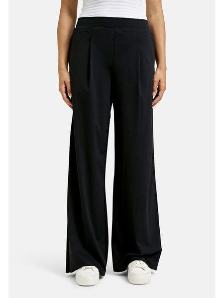 Milano Italy Spodnie w kolorze granatowym rozmiar: 42. Niebieskie spodnie materiałowe damskie Milano Italy, bez wzorów, z materiału. Za 175.26 zł.