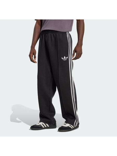 Adidas Spodnie dresowe adicolor Spacer Track JX1506 Czarny Baggy Fit. Czarne spodnie dresowe męskie Adidas, bez wzorów, z bawełny. Za 348.99 zł.