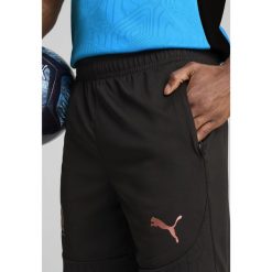Męskie szorty treningowe Olympique Marsylia PUMA Black Copper Metallic. Czarne szorty męskie Puma, bez kołnierzyka. Za 190.50 zł.
