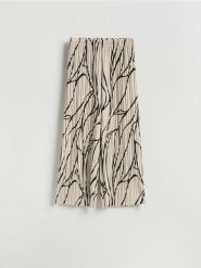 Wzorzyste spodnie - beżowy. Brązowe spodnie materiałowe damskie Reserved, bez wzorów, z dzianiny. Za 109.99 zł.