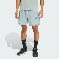 Tkane Szorty Do Ćwiczeń Essentials Base. Zielone szorty męskie Adidas, bez wzorów, sportowe. Za 119.00 zł.