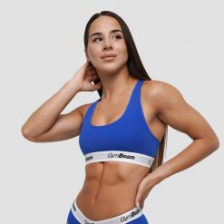 Biustonosz damski fitness z szerokimi ramiączkami niebieski Braletka. Niebieskie biustonosze sportowe damskie GYMBEAM, bez wzorów, z bawełny. Za 55.90 zł.