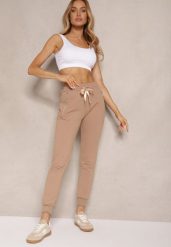 Ciemnobeżowe Spodnie Dresowe z Bawełny o Kroju Jogger High Waist Cherisa. Brązowe spodnie dresowe damskie Renee, s, bez wzorów, z bawełny. Za 49.99 zł.