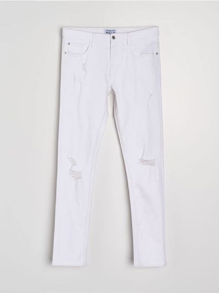Jeansy slim fit z przetarciami - biały. Białe jeansy męskie Sinsay. Za 69.99 zł.