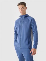 4F Bluza treningowa rozpinana z kapturem męska - niebieska M. Niebieskie bluzy sportowe męskie 4f, bez wzorów, z dzianiny, sportowe, bez kołnierzyka, bez ramiączek. W wyprzedaży za 99.99 zł.