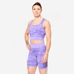 Koszulka fitness damska Domyos crop top. Fioletowe bluzki damskie DOMYOS, xl, bez wzorów, z elastanu, bez ramiączek. Za 89.99 zł.