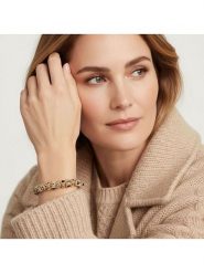 Otazu Pozłacana bransoletka z kryształami Swarovski rozmiar: onesize. Czarne bransoletki damskie Otazu, pozłacane. Za 165.31 zł.