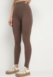 Brązowe Klasyczne Legginsy z Wysokim Stanem Melio. Brązowe legginsy damskie Born2be, l, bez wzorów, z jeansu. Za 44.99 zł.