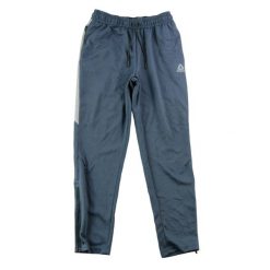 Spodnie dresowe męskie z suwakami przy kostkach niebieskie. Niebieskie spodnie sportowe męskie Reebok, z dresówki. Za 122.16 zł.