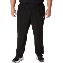 Spodnie dresowe Asics Core woven. Czarne spodnie sportowe męskie Asics, z dresówki. Za 284.25 zł.