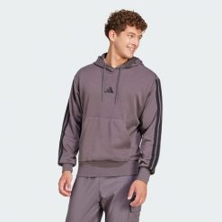 Bluza z kapturem Essentials 3-Stripes French Terry. Białe bluzy sportowe męskie Adidas, bez wzorów, z materiału, sportowe, bez kołnierzyka, bez ramiączek. Za 222.00 zł.