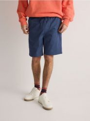 Szorty jogger - granatowy. Niebieskie szorty męskie Reserved, z bawełny, bez kołnierzyka. W wyprzedaży za 79.99 zł.