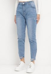 Niebieskie Jeansy o Dopasowanym Fasonie z Modnymi Przedarciami Baleunita. Niebieskie jeansy damskie Born2be. Za 89.99 zł.