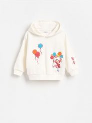 Bluza z aplikacją Basia - złamana biel. Bluzy i bluzki niemowlęce Reserved, z aplikacjami, z bawełny, bez ramiączek, bez kaptura. Za 59.99 zł.