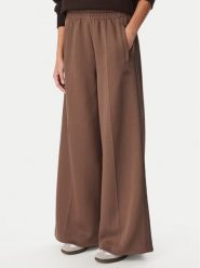 Adidas Spodnie dresowe Spacer Tracksuit Bottoms KZ2199 Brązowy jasny Relaxed Fit. Brązowe spodnie dresowe damskie Adidas, m, bez wzorów, z dresówki. Za 299.99 zł.