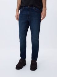 Jeansy carrot slim z efektem sprania - granatowy. Niebieskie jeansy męskie Reserved. Za 129.99 zł.