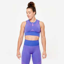 Koszulka fitness damska Domyos crop top bez rękawów. Czerwone bluzki sportowe damskie DOMYOS, m, bez wzorów, z elastanu, bez ramiączek. W wyprzedaży za 69.99 zł.