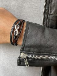 Uomo Skórzana bransoletka w kolorze czarno-brązowym rozmiar: onesize. Brązowe biżuteria dla mężczyzn Uomo, ze stali. Za 122.09 zł.