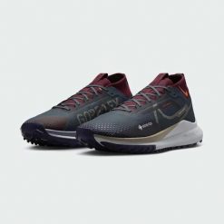 Buty Sportowe Męskie Nike Pegasus Trail 4 Gtx V2. Zielone buty sportowe na co dzień męskie Nike, z gore-texu, bez zapięcia, wspinaczkowe, gore-tex. Za 576.40 zł.