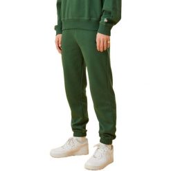 Spodnie męskie New Era Heritage. Zielone spodnie materiałowe męskie New Era, bez wzorów, z bawełny. Za 290.00 zł.