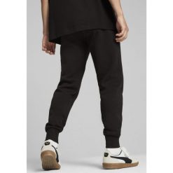 Męskie spodnie dzianinowe z logo PUMA × HYROX PUMA Black. Czarne spodnie materiałowe męskie Puma, bez wzorów, z dzianiny, sportowe. W wyprzedaży za 164.00 zł.